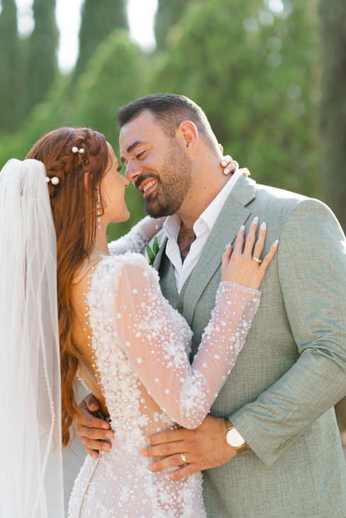 A close-up, joyful portrait of Laurel and Thomas smiling at each other, showcasing the bride's pearl-detailed gown at a Zion National Park Wedding.