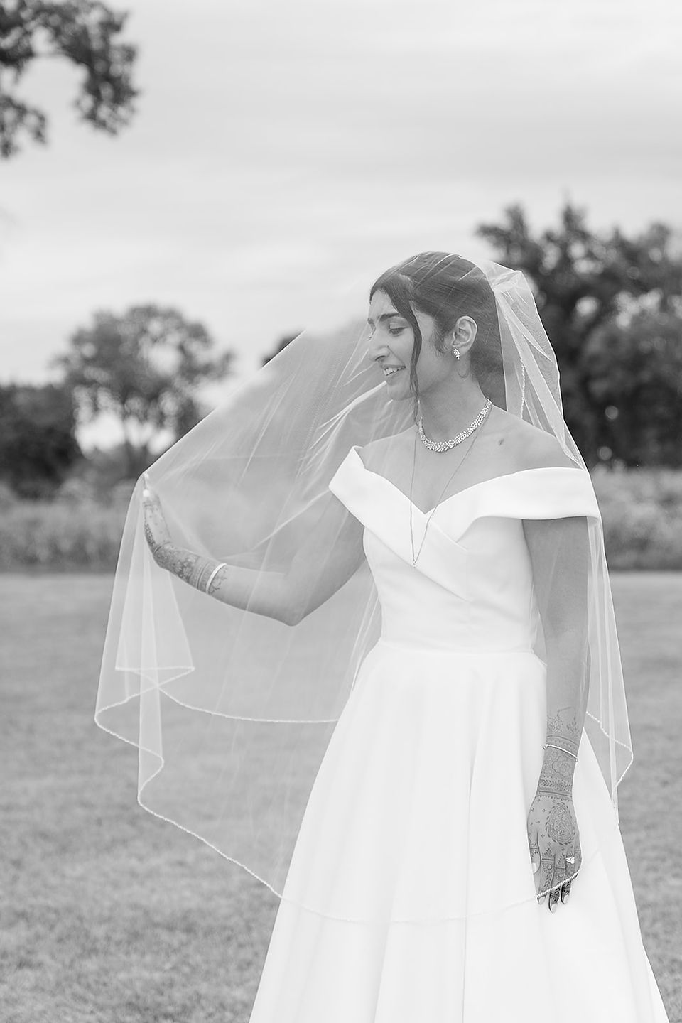 Black and white portrait of bride Sarah under her veil at Norwood Hills Country Club during her Big Bow Events planned wedding.