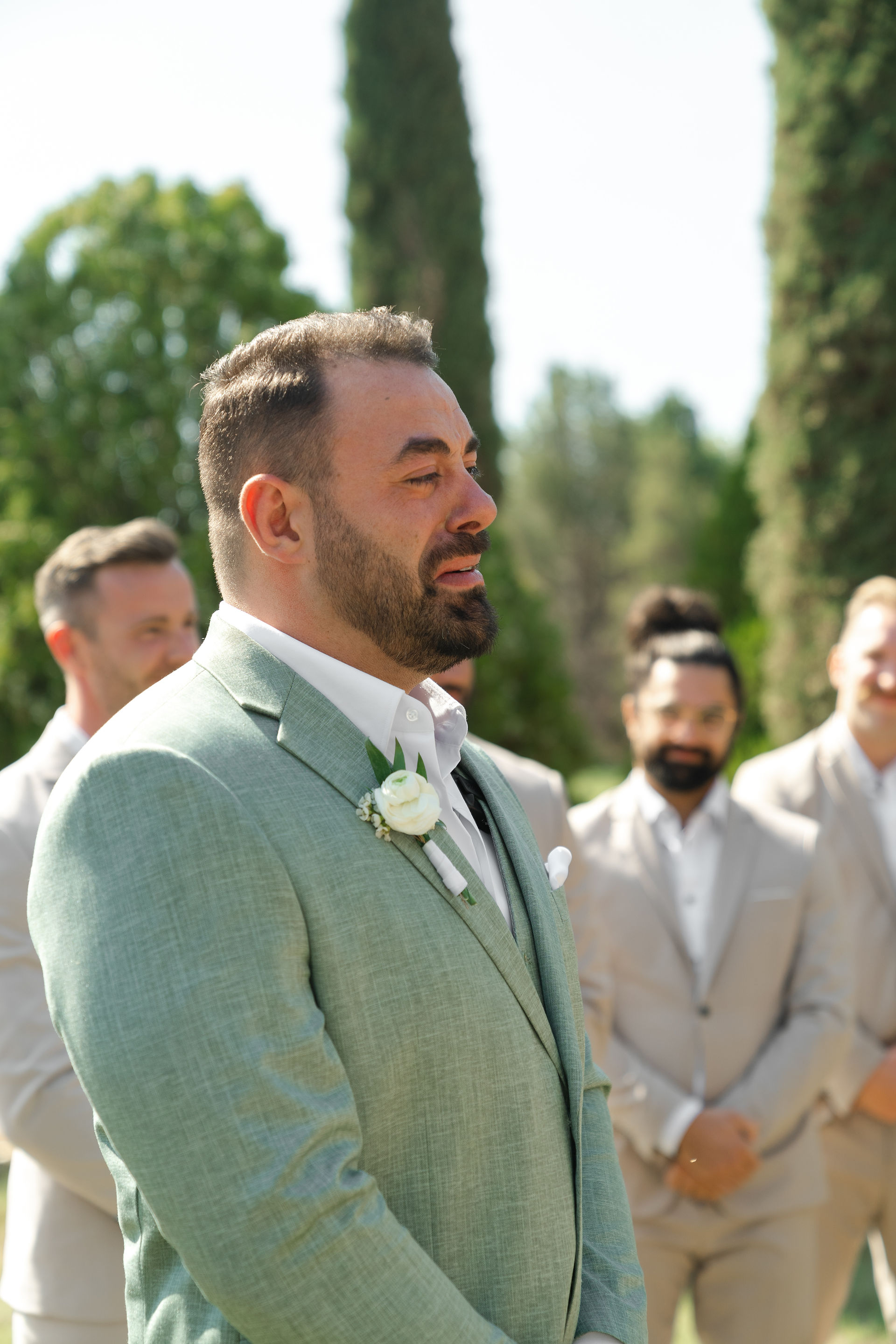 An emotional close-up of the groom, Thomas, as he watches the bride walk down the aisle during their Zion National Park Wedding ceremony.