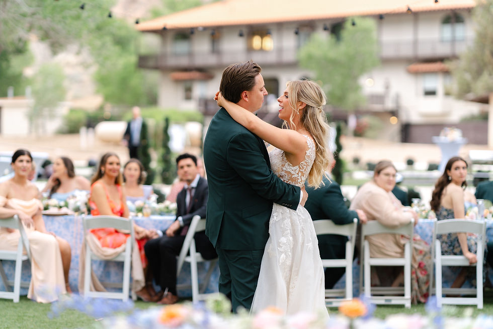 A bride and groom share their first dance.