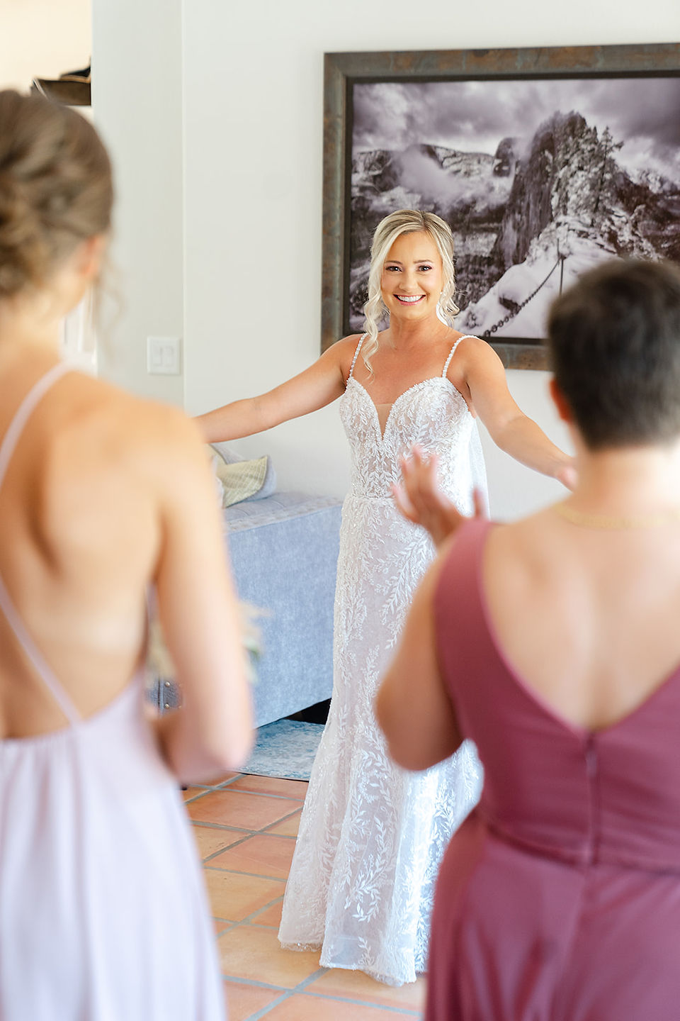 A joyful bride and bridesmaid sharing a laugh while preparing for a Zion National Park wedding.