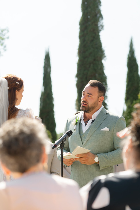 A close-up of the groom, Thomas, reading his heartfelt handwritten vows during his outdoor Zion National Park Wedding.