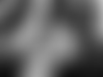 A high-energy black and white photo of a bride and groom during their wedding reception exit at Stone Tree Golf Club in Novato, California, surrounded by cheering guests with glowing light wands.