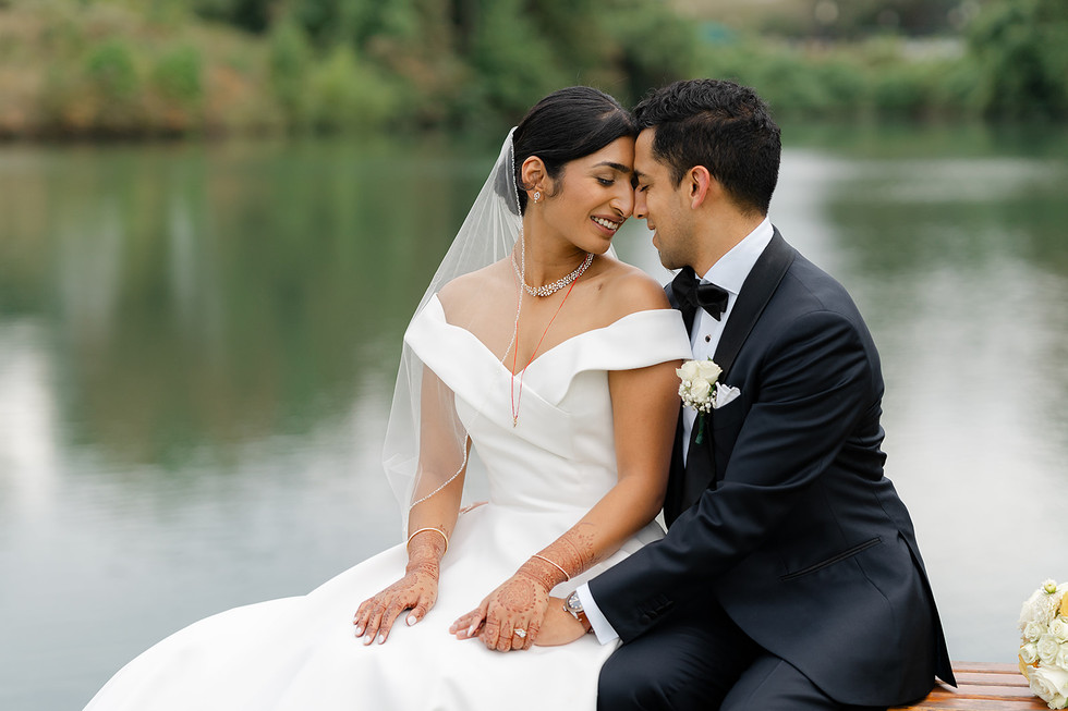 Close-up intimate portrait of Sarah and Vince with eyes closed, showcasing her off-the-shoulder gown and his classic tuxedo at Norwood Hills Country Club in St. Louis.