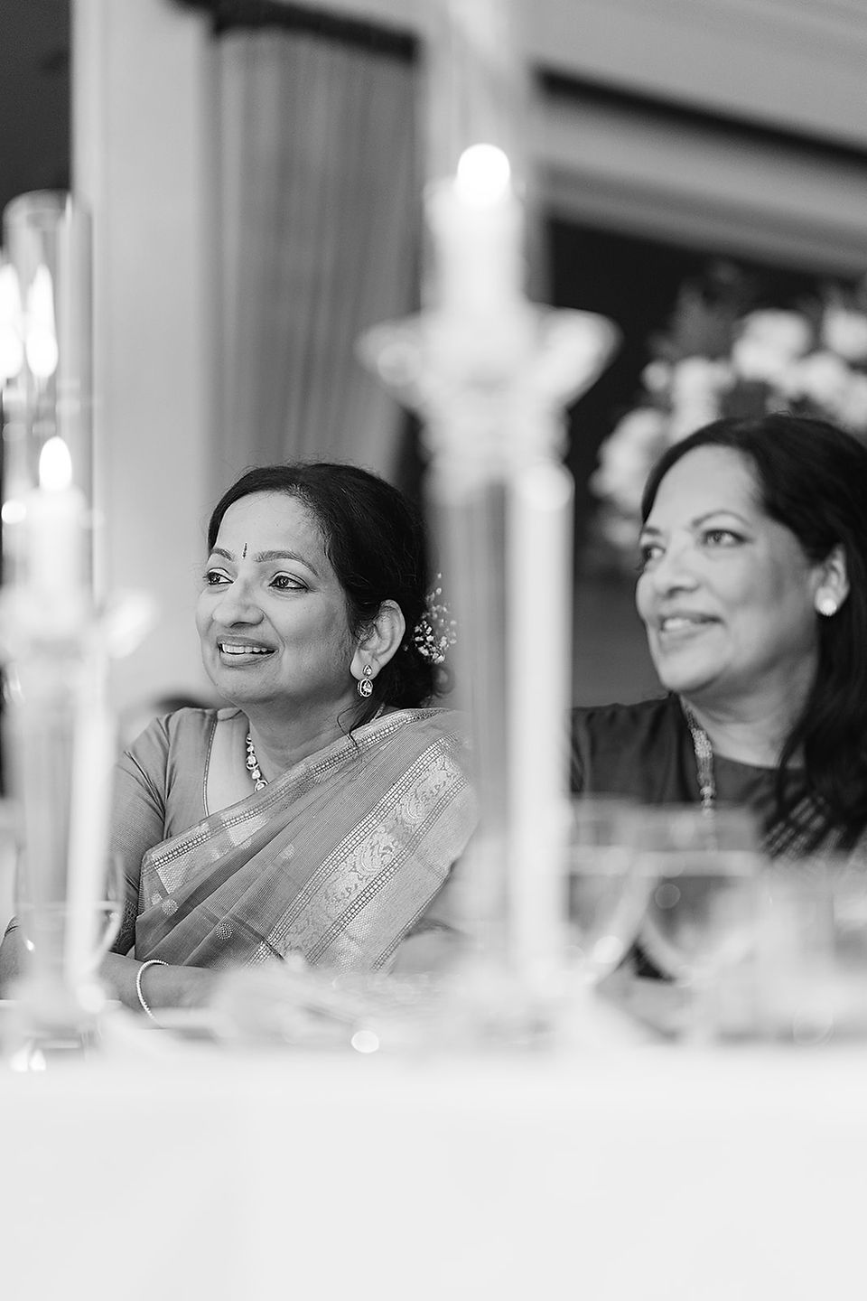 Intimate black and white photo of Vince’s mother and a family member sharing a quiet moment during the Big Bow Events planned reception in St. Louis.