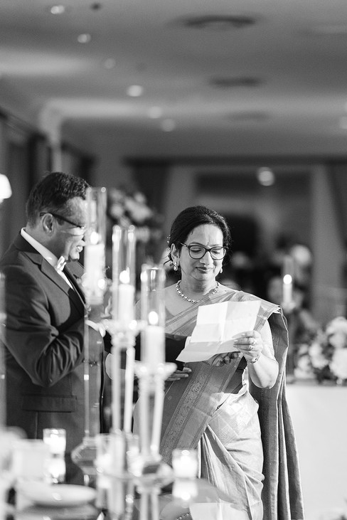 Vince’s mother wearing a traditional saree and reading a heartfelt speech at the Norwood Hills Country Club wedding reception in St. Louis.