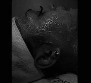 chrissy black and white facial.jpeg