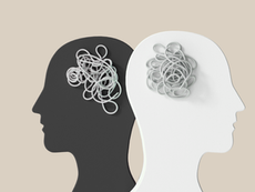 Two profile heads, black and white, face opposite directions with tangled lines in their brains; AH E logo on beige background