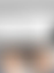 Hands typing on a laptop displaying an email titled "Question Regarding Assignment" from a college professor. Gray background.