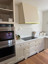 Complete kitchen transformation in Oak Park replacing dated oak cabinets with modern slab-front doors and gold hardware.