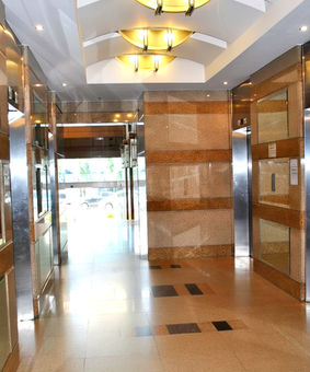 Premium office building One San Miguel Avenue in Ortigas Center Pasig City by Amberland Corporation, offering modern office spaces for rent or sale.