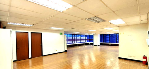 Strata 100 Ortigas Center office spaces for lease, modern commercial building with clean interiors, flexible office layouts ideal for SMEs and corporate back-offices, conveniently located near SM Megamall and Shangri-La Plaza in Pasig City, accessible via major roads and public transport.