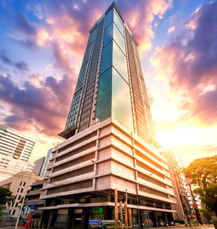Premium office building One San Miguel Avenue in Ortigas Center Pasig City by Amberland Corporation, offering modern office spaces for rent or sale.