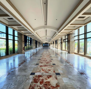 PNB Financial Center office building in Manila Bay Area, Pasay City, modern Grade A commercial office space with Grand Atrium, rooftop deck, EV charging stations, 24/7 access, located beside Concept Mall along a busy highway, ideal for corporate headquarters, professional services, and flexible office leasing