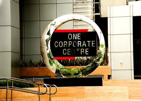 Alt: One Corporate Centre in Ortigas Center, Pasig City – a 54-storey Grade A, PEZA-accredited office tower developed by Amberland Corporation, offering premium office spaces for rent with modern amenities, strategic location, and world-class business facilities along Meralco Avenue.