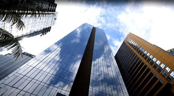 Corporate Finance Plaza Ortigas Center Grade-A office building with modern architecture, high-speed elevators, 100% backup power, podium gardens, flexible office layouts, prime commercial location in Metro Manila, ideal for corporate offices and business headquarters.