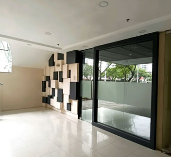 Modern commercial building San Juan Keyland Plaza in Metro Manila featuring premium office spaces for lease, ideal for BPO, corporate, and retail businesses in a prime accessible location.