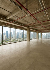 Spacious bare shell office floor in Altaire, Makati CBD, featuring open-plan layout, high ceilings, exposed structural columns, polished concrete flooring, and floor-to-ceiling windows with panoramic city views. Ideal for corporate offices, BPO setups, or flexible commercial workspace.