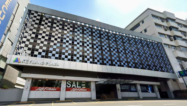 Modern commercial building San Juan Keyland Plaza in Metro Manila featuring premium office spaces for lease, ideal for BPO, corporate, and retail businesses in a prime accessible location.