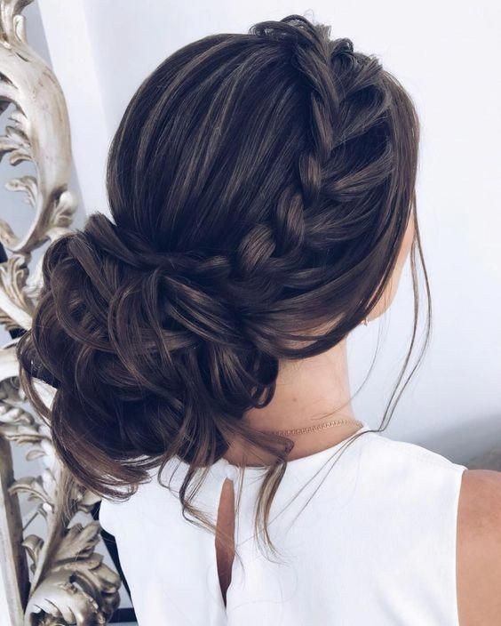 low bun hair style with french plait bridal and weddings