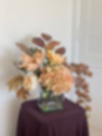 peach dreams bouquet from distance showing all flowers including water chestnuts cascading