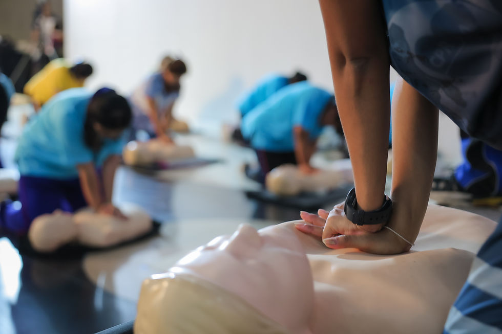 A person performs CPR chest compressions on a during a training session, highlighting esse