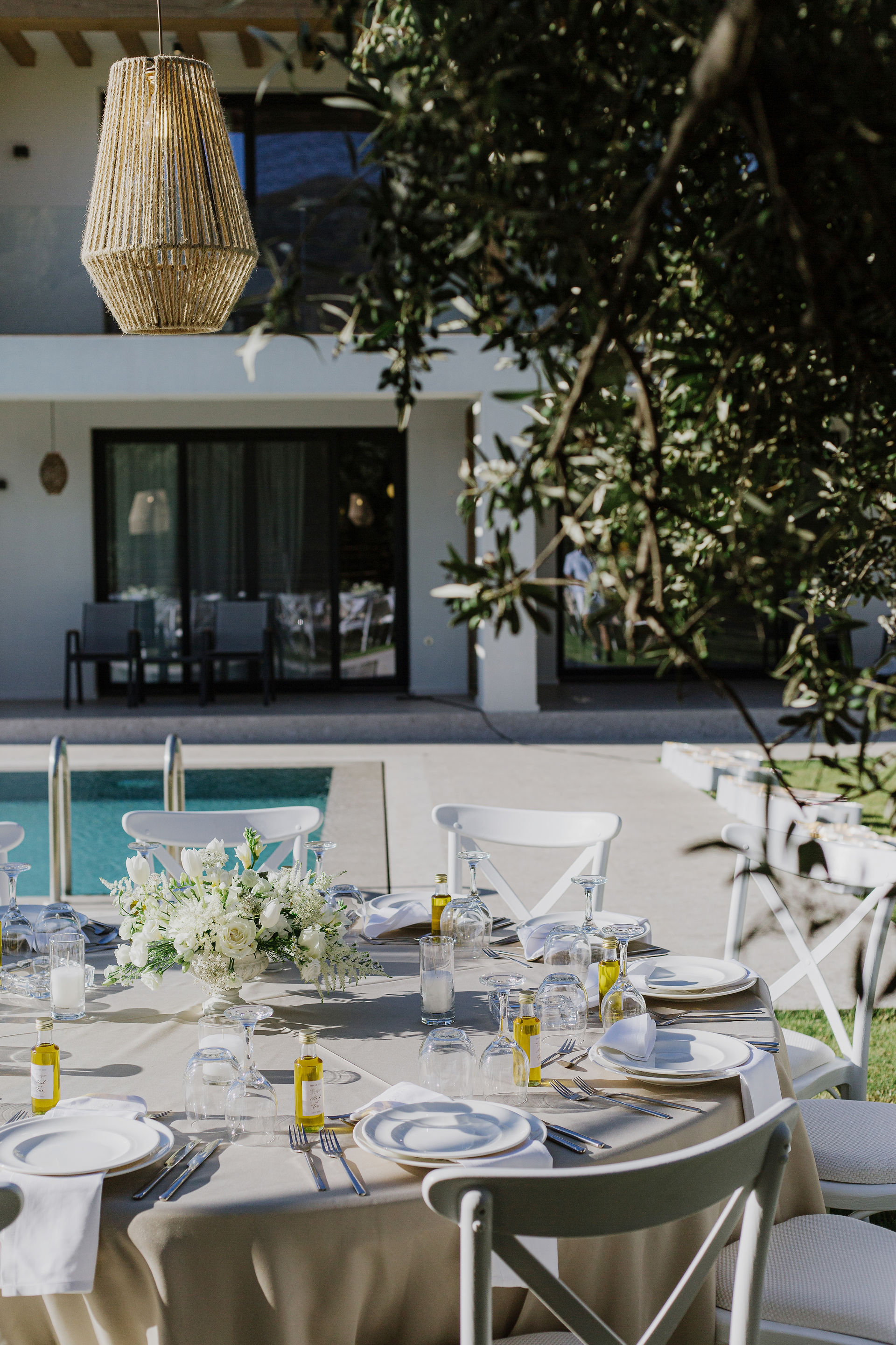 Summer wedding table setup in villa in Greece boho lamps