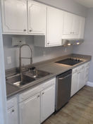 602 double sink with high arch faucet, dishwasher, and 4 burner cooktop