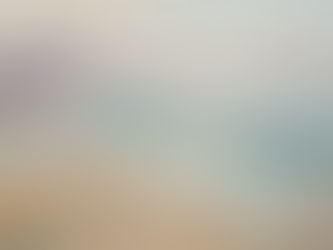 a soft painterly shoreline at low tide with teal pools of water and a misty purple sky