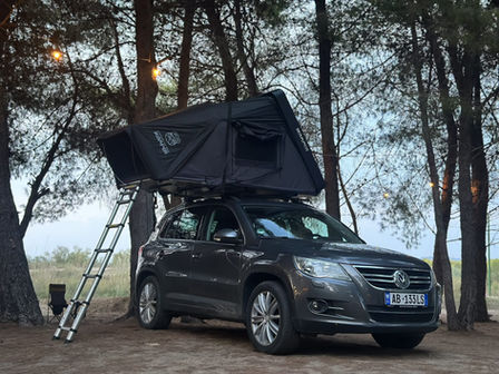 Car with rooftop tent