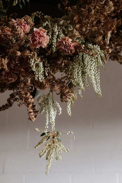Hanging wildflower arrangement with ferns
