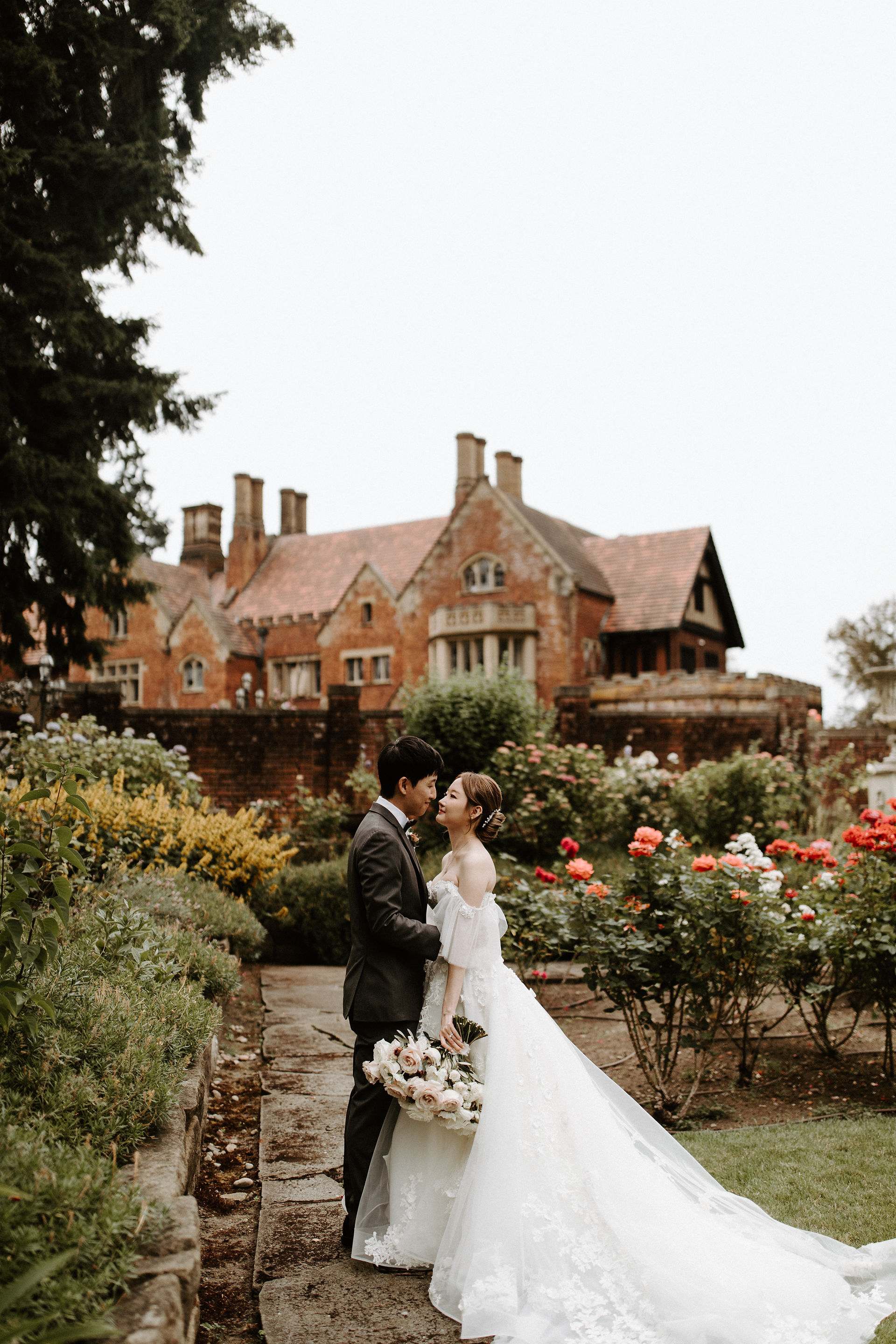 Bride and groom in the garden at Thronewood Castle near Tacoma