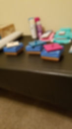 Small wooden boxes and art supplies on a dark table