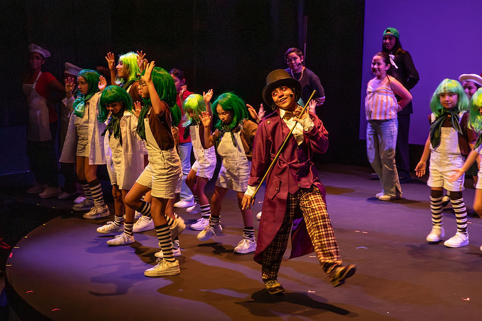 Raymah C. stuns as Willy Wonka with her Oompa Loompas!