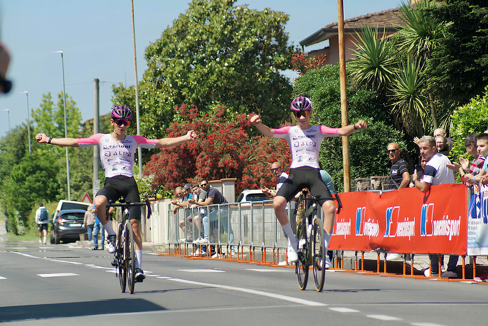 Eye-level view of Team Iperfinish cyclists in action during a race