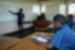 Children Of Grace students participating in a classroom lesson
