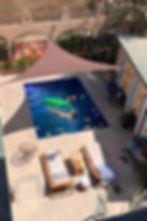 Drone view of the pool courtyard at a private villa