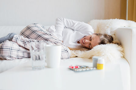 Woman having stomach cramps.jpg