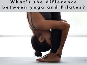 Woman in forward fold in a yoga class at V Flow, Ribble Valley