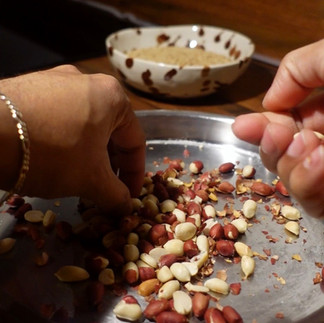 roasting red peanuts for rose chikki