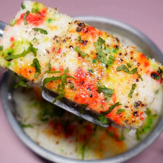 close up of the surti idada with garnished coriander leaves ready to be served