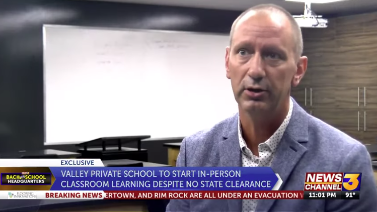 Kirk Scott telling KESQ News how God is going to protect everyone on the school campus from COVID with his magic. (Source: KESQ News, kesq.com)