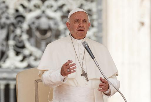 Pope Francis speaking in St. Peter's Square in the Vatican.