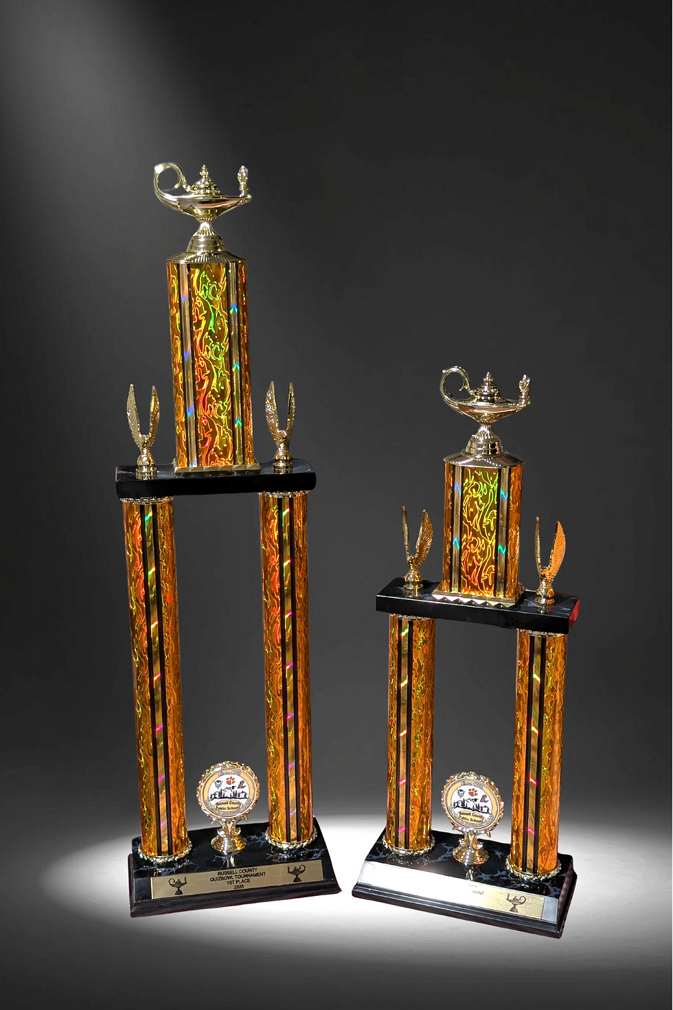 Two ornate trophies with gold and black detail. Medals, Ribbons, Inserts, and Chenille Pins (Starting at $3.50)