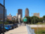Looking straight down Grand Avenue into the heart of downtown Des Moines, with the Ruan Center and historic Equitable Building rising against the September sky.
