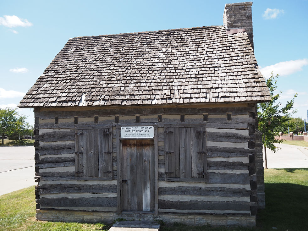 A preserved log cabin marking the birthplace of Des Moines, once part of Fort Des Moines No. 2.