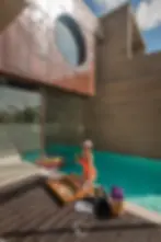 girl in orange swimming suit in the pool