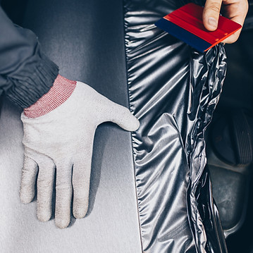 car-wrapping-specialist-putting-vinyl-foil-film-car-selective-focus.jpg