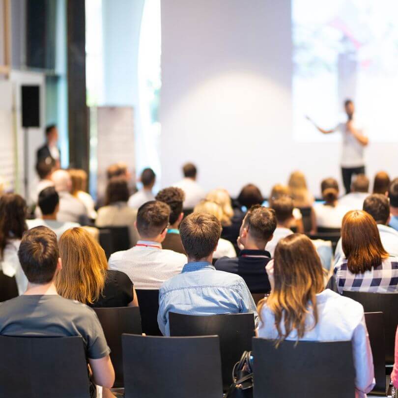 Conference attendees gathered for a presentation