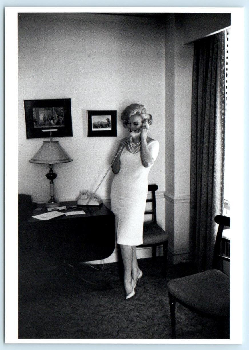 Marilyn Monroe using a telephone at the Ambassador East Hotel
